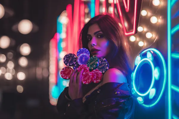 BET786 — A high-class gaming experience without limits A woman in a luxurious green gown next to an ornate roulette wheel, capturing the upscale casino mood of BET786.